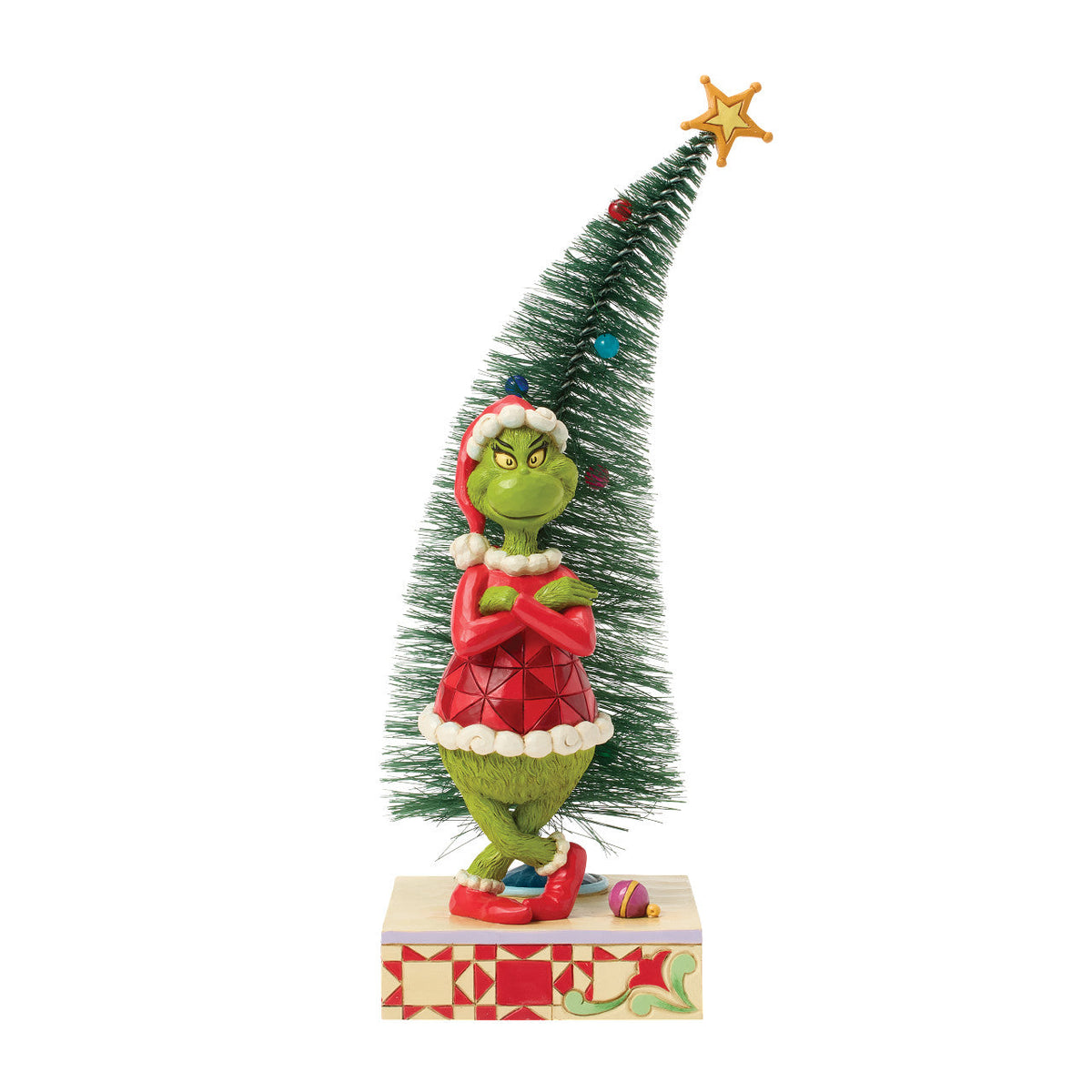 Grinch with Arms Crossed by Christmas Tree